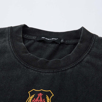 Close-up of the Retro Washed Badge Letter T-Shirt – Loose Fit showcasing its vintage badge print and relaxed fit design.