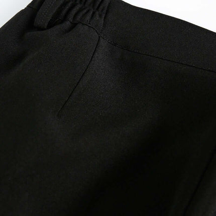 Close-up view of the waistband of Wide Leg Pleated Plaid Trousers showcasing the elastic drawstring detail.