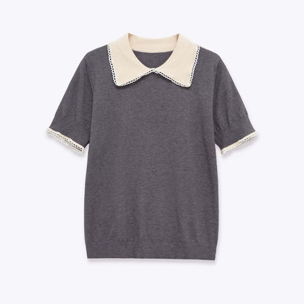 Close-up of Gray lace patchwork polo knit sweater fabric