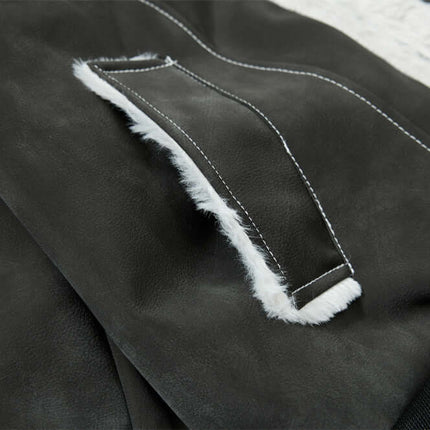 Close-up of the Street Style Cotton Jacket – Loose Fit, showcasing the PU leather paneling and ribbed hem details.