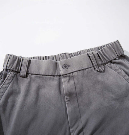 Close-up of the waistband of the Patchwork Distressed Knife Pants showcasing its tailored design and elastic features.