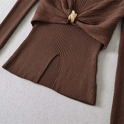 Image of the Metal Knot Hollow-Out Flare Sleeve Knit Top showcasing its ribbed fabric and metal knot detail.