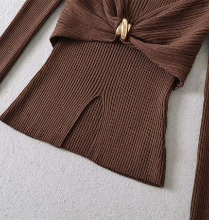 Image of the Metal Knot Hollow-Out Flare Sleeve Knit Top showcasing its ribbed fabric and metal knot detail.