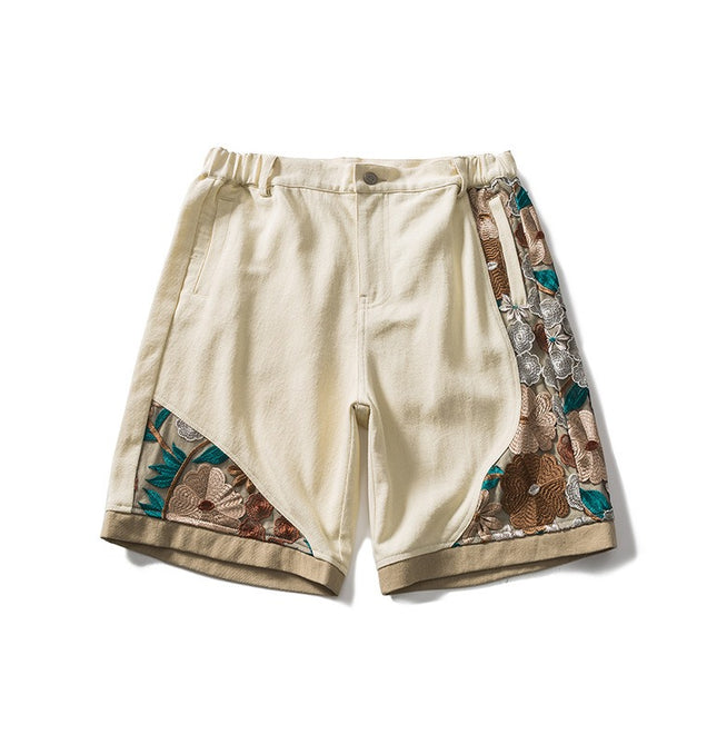 Trendy men's street style relaxed-fit cotton shorts with intricate floral embroidery, suitable for sports and casual wear.