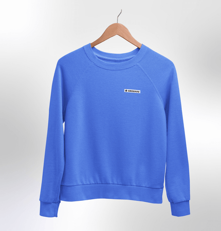 A trendy fuzzy sweatshirt with bold urban prints, combining streetwear flair and maximum comfort for all-day wear