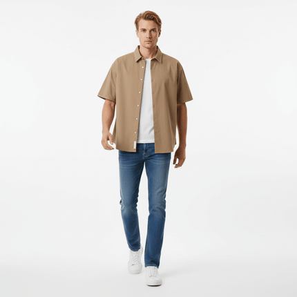 Minimal Casual Loose Short Sleeve Shirt worn by a man with jeans and white sneakers.