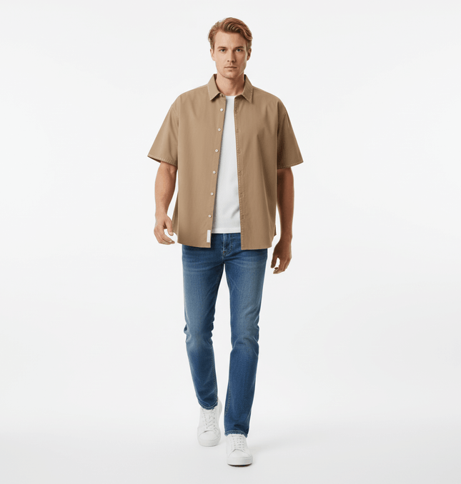 Minimal Casual Loose Short Sleeve Shirt worn by a man with jeans and white sneakers.