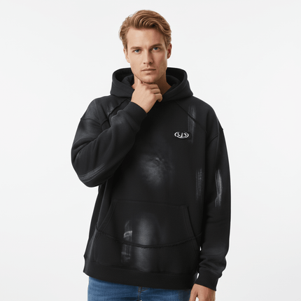 Creative Vintage Hoodie – Loose Fit worn by a model, featuring a black design with artistic graphics and a hood.