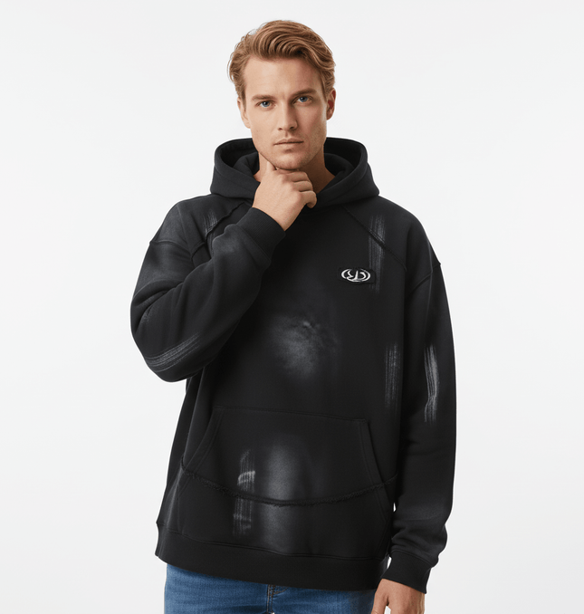 Creative Vintage Hoodie – Loose Fit worn by a model, featuring a black design with artistic graphics and a hood.