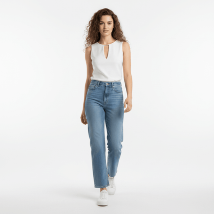 A model showcasing a VNeck Sleeveless Crop Top - Slim Fit with high-waisted jeans, walking confidently.