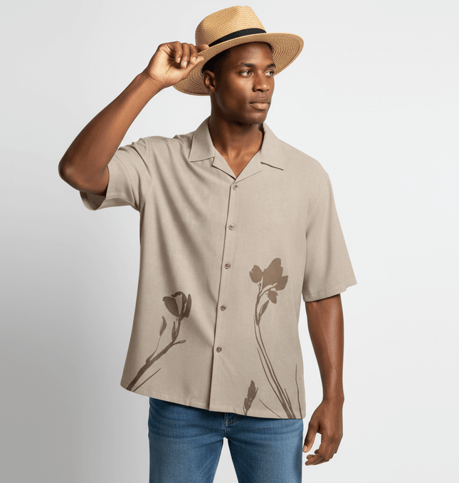 Suede Short Sleeve Shirt - Loose Fit worn by a man with a straw hat, featuring floral design and a relaxed silhouette.