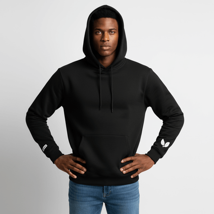 Cross Embroidered Hoodie – Loose Fit worn by model, showcasing a minimalist design and hooded style.