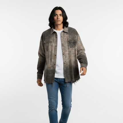 Radiant Plaid Distressed Shirt – Loose Fit worn by a model showcasing its relaxed fit and stylish frayed hem design.