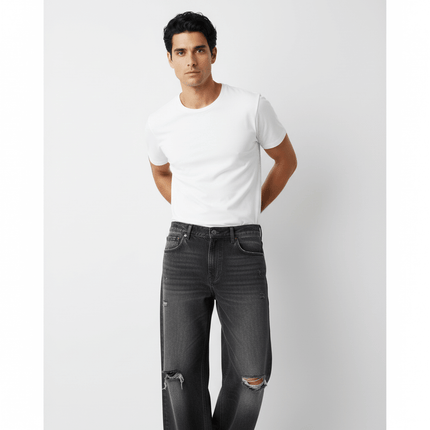 Washed Distressed Denim Pants showcased on a model wearing a white t-shirt, perfect for casual street style.