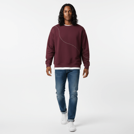 Round Neck Letter Print Hoodie – Loose Fit modeled by a man in a maroon sweatshirt and blue jeans.