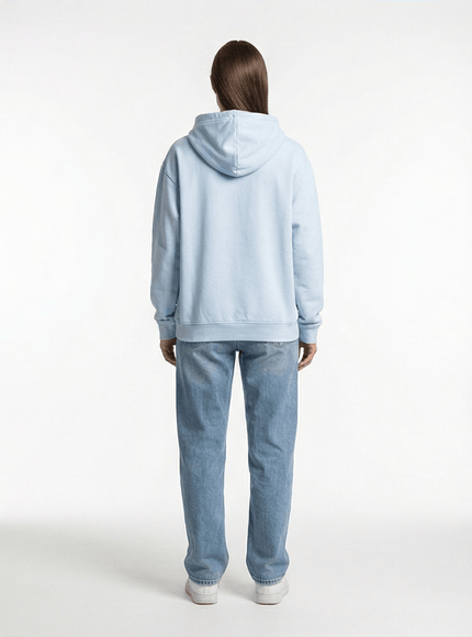 Model wearing washed oversized hoodie by Grozavu