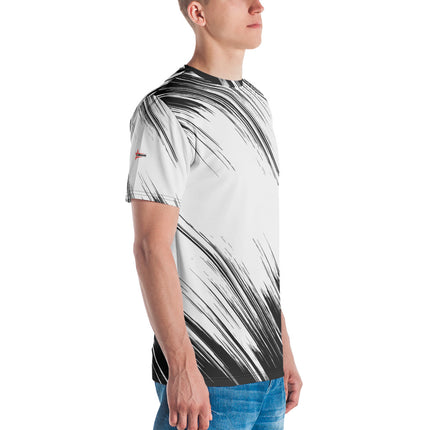 Man wearing a Grozavu organic cotton t-shirt with black and white abstract print, paired with blue jeans for a relaxed, stylish look