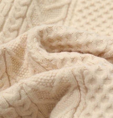 Letter Beaded Knit Sweater – Loose Fit fabric texture close-up in apricot color with intricate patterns.