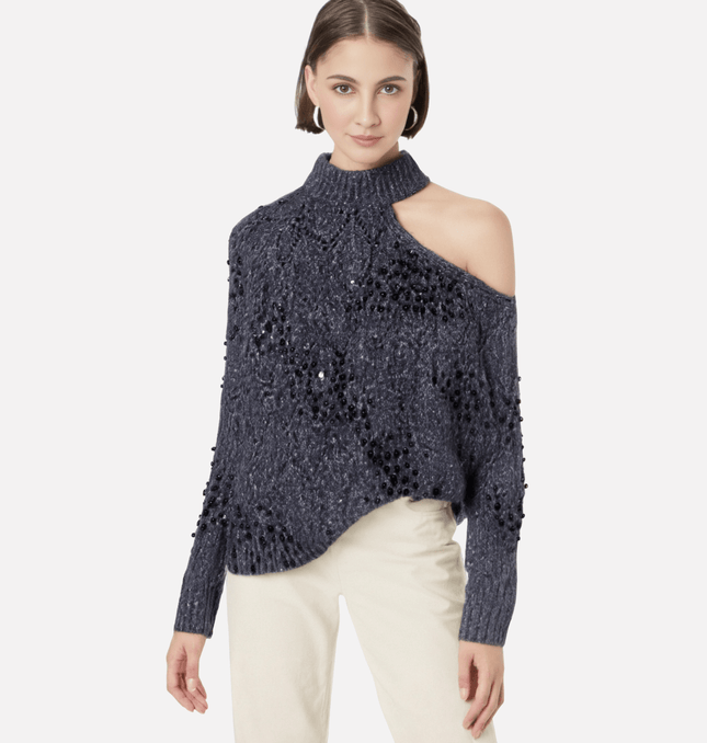 Asymmetrical Off-Shoulder Knit Sweater showcased by a model, featuring a stylish shoulder opening and hollow bead decoration.