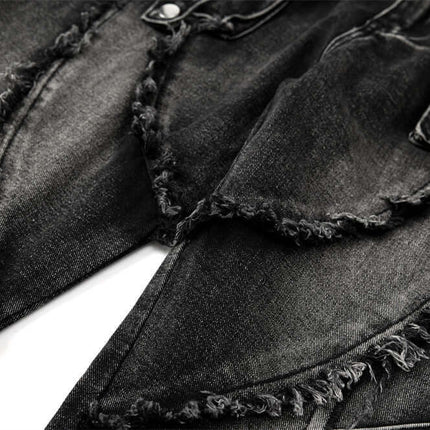 Belted Distressed Cargo Jeans close-up showcasing raw hem detailing and faded black denim texture.