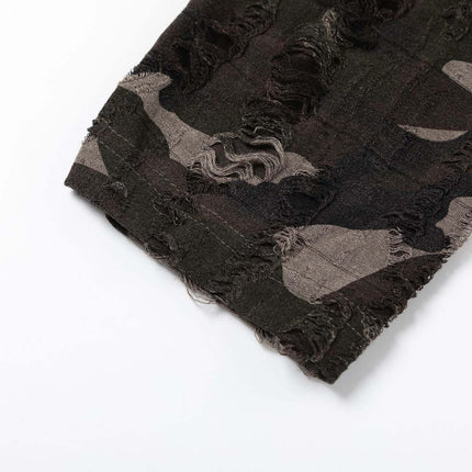 Detail of the fabric featuring a textured, frayed edge in a dark camouflage pattern.