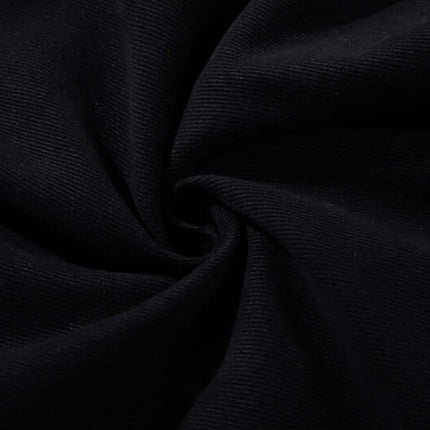 Close-up of fabric texture showing the dark elastic material of Graffiti Printed Cargo Denim Pants.