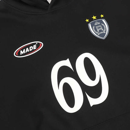 Detail of Oversized Hooded Sweatshirt – Loose Fit with logo and number 69 on black fabric.