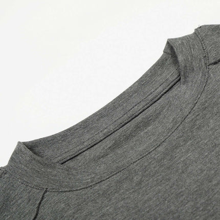 Close-up view of the neckline of the Bottom Knit Long Sleeve Pullover in medium gray.