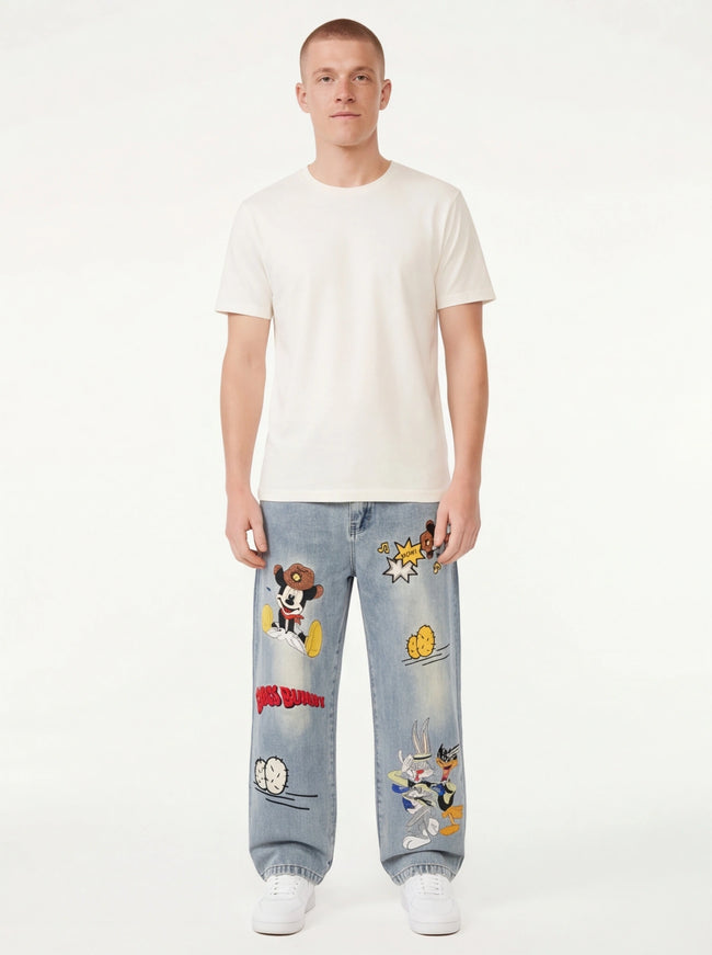 Close-up of Blue cartoon embroidered washed denim fabric