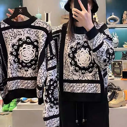 Camellia Jacquard Beaded Knit Sweater displayed on model wearing matching outfit in urban setting.