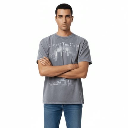 Printed Short Sleeve TShirt – Loose Fit worn by a man with a graphic design on a gray background.
