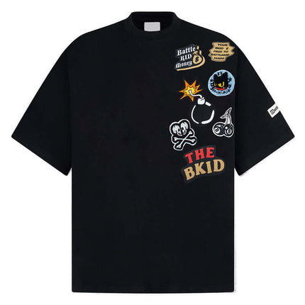 Cartoon Badge Cotton TShirt – Loose Fit featuring playful graphics and a relaxed oversized design.