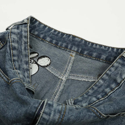 Casual Embroidered Denim Cropped Pants close-up showing detail of waistband and embroidery.