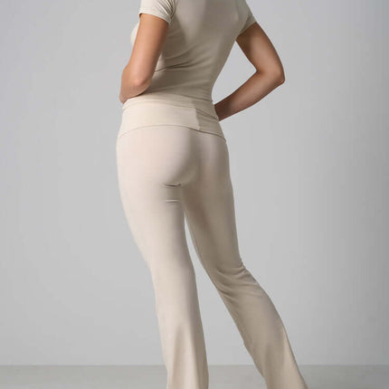 Casual Fit Cotton Jersey Yoga Set showcasing a woman in a stylish beige two-piece outfit from the back.