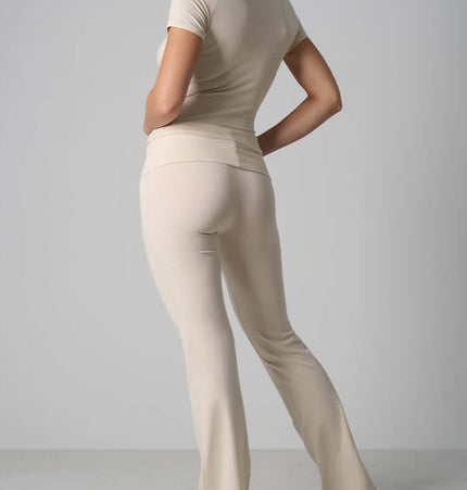 Casual Fit Cotton Jersey Yoga Set showcasing a woman in a stylish beige two-piece outfit from the back.