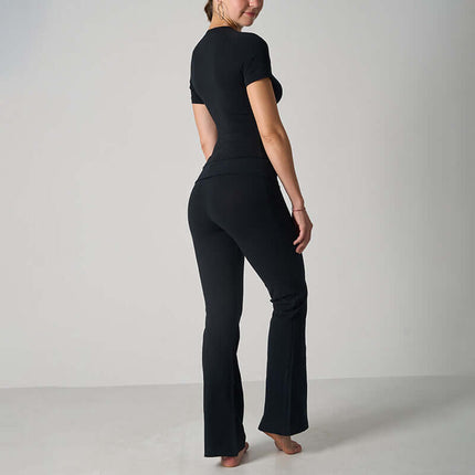 Casual Fit Cotton Jersey Yoga Set worn by a woman, showcasing the stylish back view of the crop top and flare pants.
