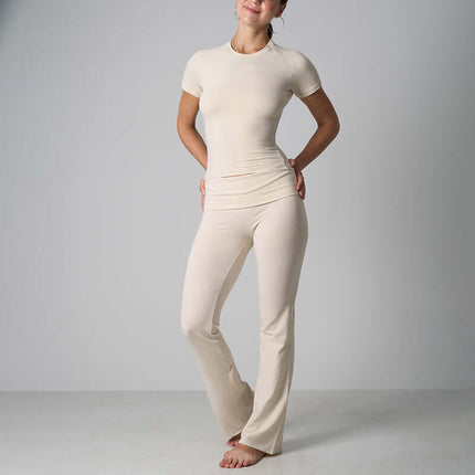 Casual Fit Cotton Jersey Yoga Set in beige, featuring a crop top and high-waist flare pants, ideal for yoga and lounging.