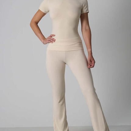 Casual Fit Cotton Jersey Yoga Set worn by a model featuring a crop top and high-waist flare pants.