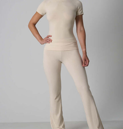Casual Fit Cotton Jersey Yoga Set worn by a model featuring a crop top and high-waist flare pants.