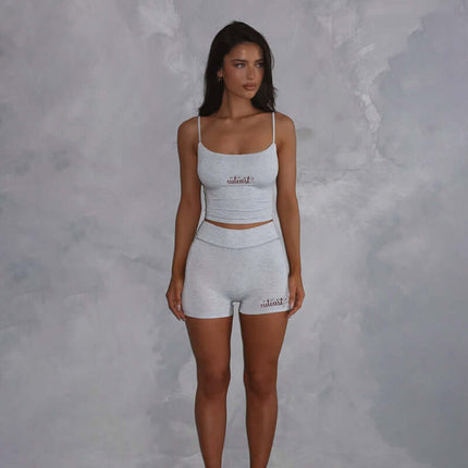 Casual Fit Square Neck Sleeveless Outfit worn by a model in a light gray two-piece shorts set with a square neckline.