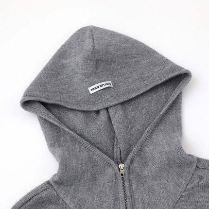 Casual Solid Color Tracksuit Set showing a close-up of the gray hoodie with a zipper and brand label.