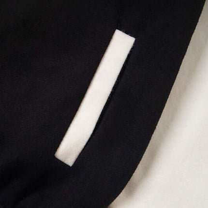 Close-up of the pocket detail on the Cat Embroidered Baseball Jacket - Loose Fit, showcasing its stylish design.