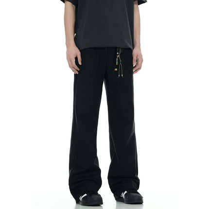 Classic Straight Pants – Slimming Fit displayed in black color, featuring a relaxed fit and modern design.