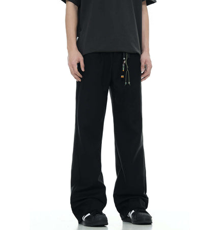 Classic Straight Pants – Slimming Fit displayed in black color, featuring a relaxed fit and modern design.