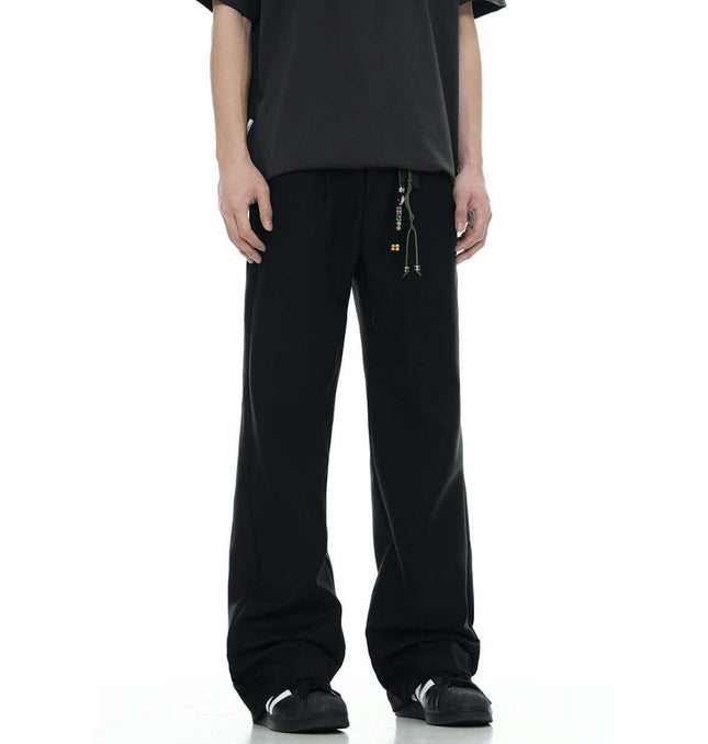 Classic Straight Pants – Slimming Fit displayed in black color, featuring a relaxed fit and modern design.