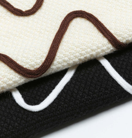 Close-up of Color Block Line Knit Sweater – Loose Fit showing color block line designs in cream, brown, and black.