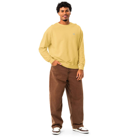 Model wearing Comfort Colors 1466 Lightweight Crewneck in mustard yellow with brown pants.