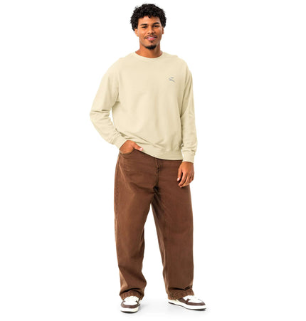 Man wearing Comfort Colors 1466 Lightweight Crewneck in beige with brown pants, showcasing relaxed fit and vintage style.