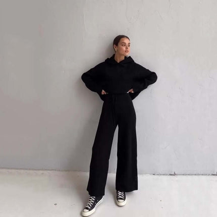 Cotton Blend Two-Piece Sports Set worn by a model against a neutral wall, showcasing a hoodie and matching pants.