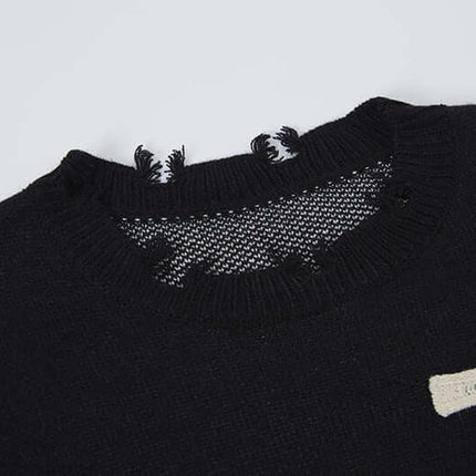 Close-up of the neck and collar of the Cross Jacquard Knit Sweater – Loose Fit, showcasing its unique design details.